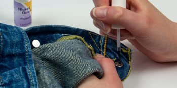 Nickel Guard being painted on a jeans rivet